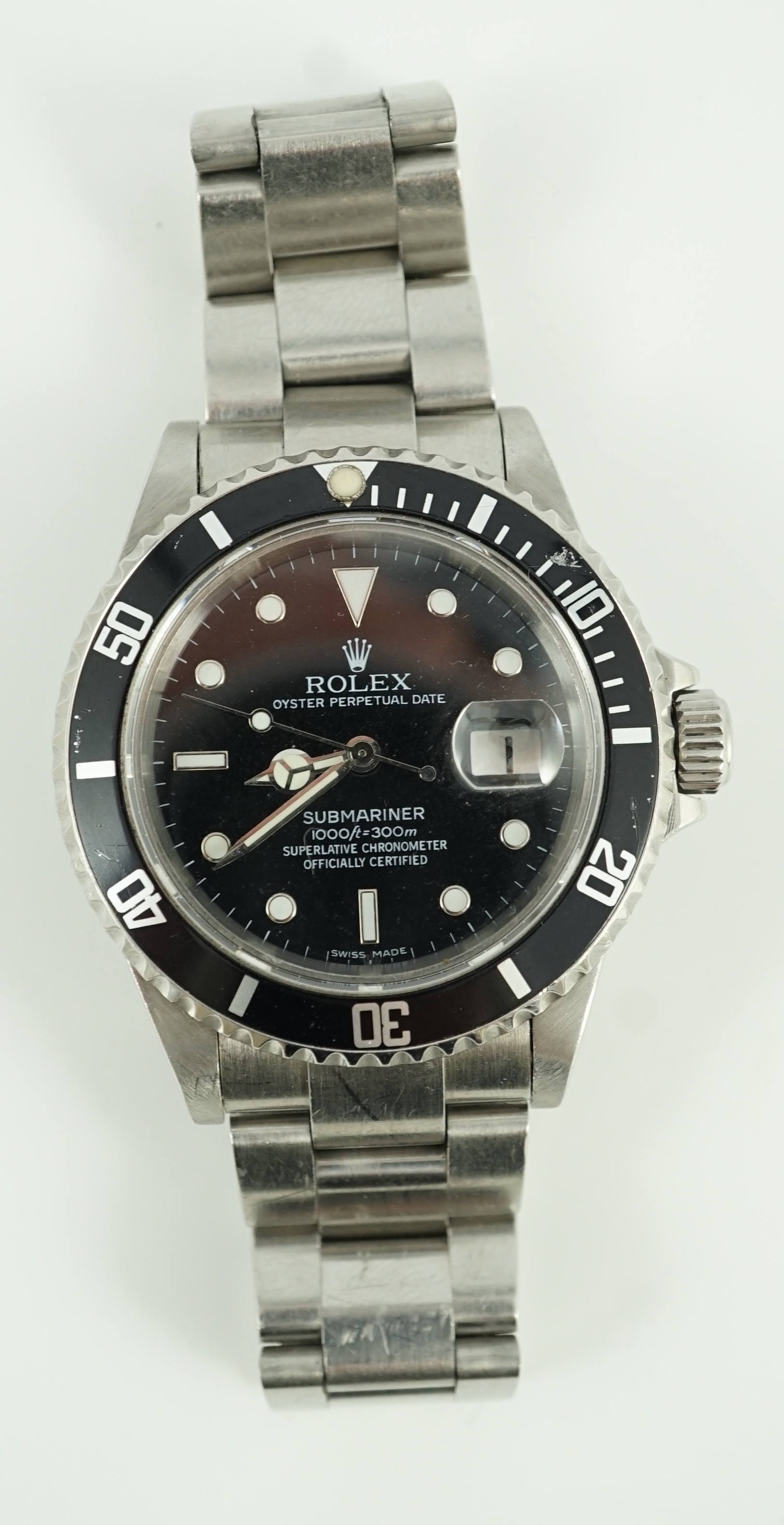 A gentleman's mid 1980's stainless steel Rolex Submariner Oyster Perpetual Date wrist watch, on a stainless steel Rolex bracelet